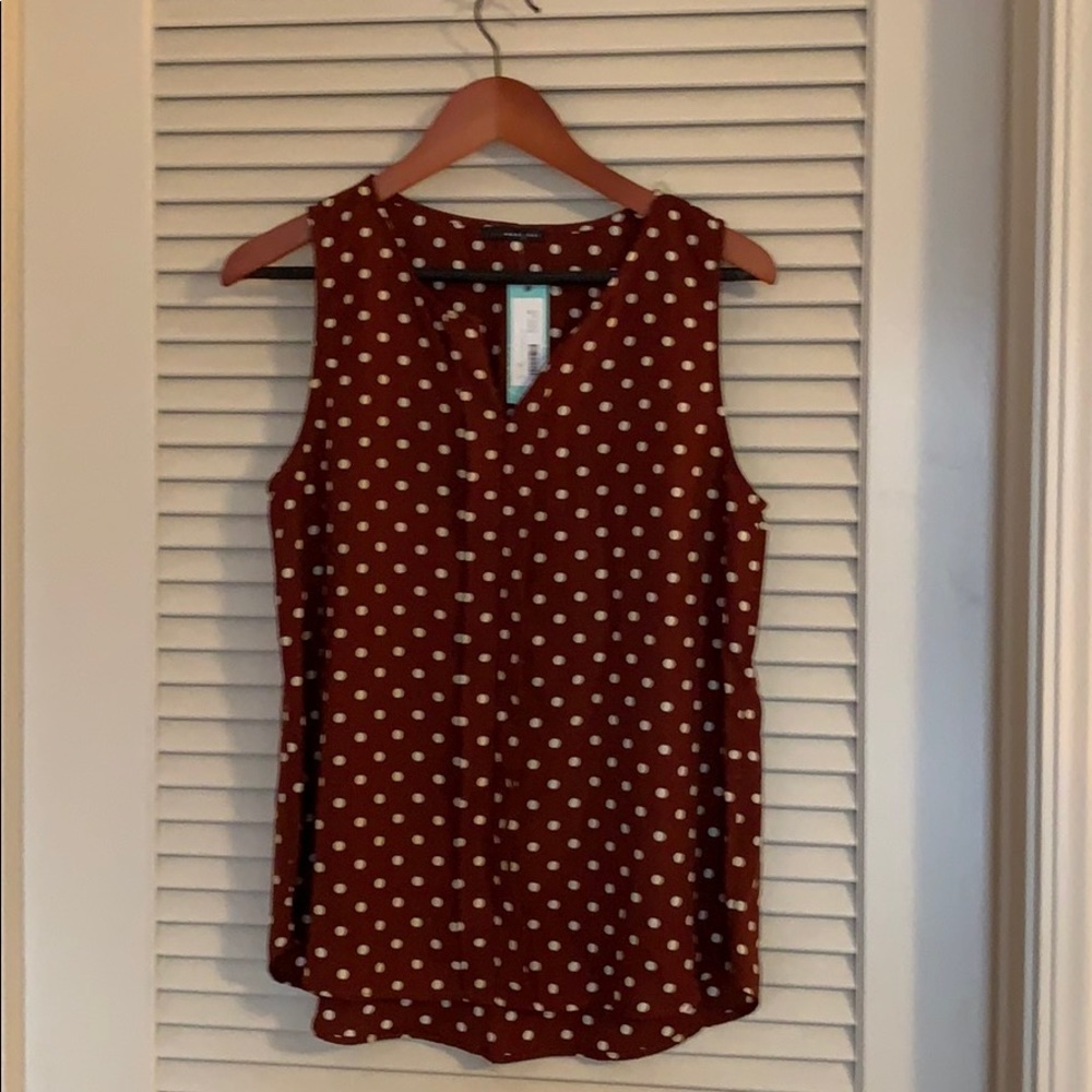 Brown and white polka dot sleeveless blouse